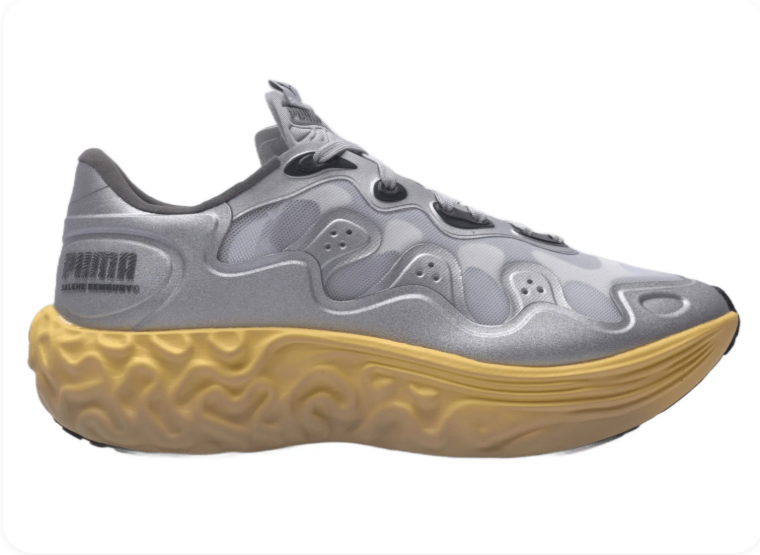 Puma Mostro Running Grey Gum – side profile view showing sculptural wave-form upper and chunky gum midsole