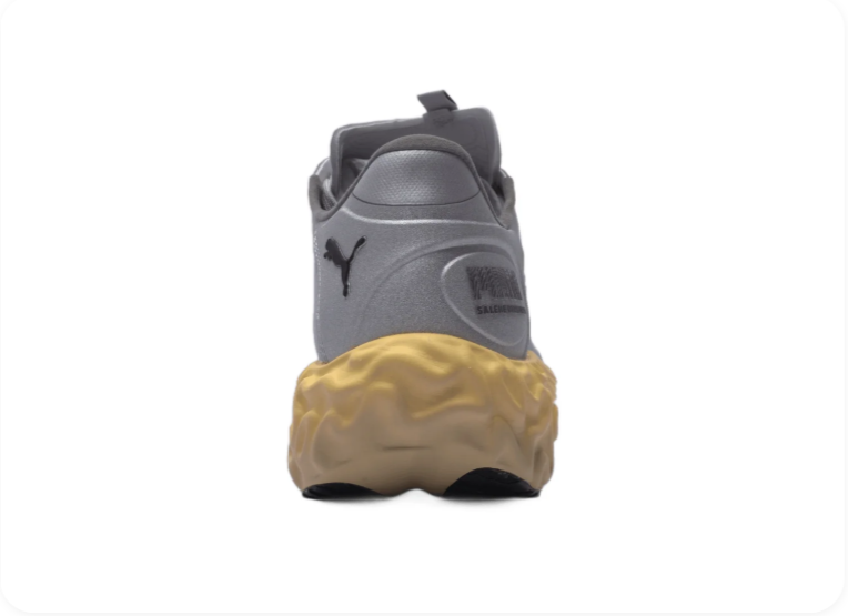 Puma Mostro Running Grey Gum – rear heel view showing gum midsole and pull tab