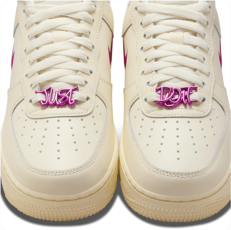 Nike Air Force 1 Low Just Do It – close-up of metallic lace jewel